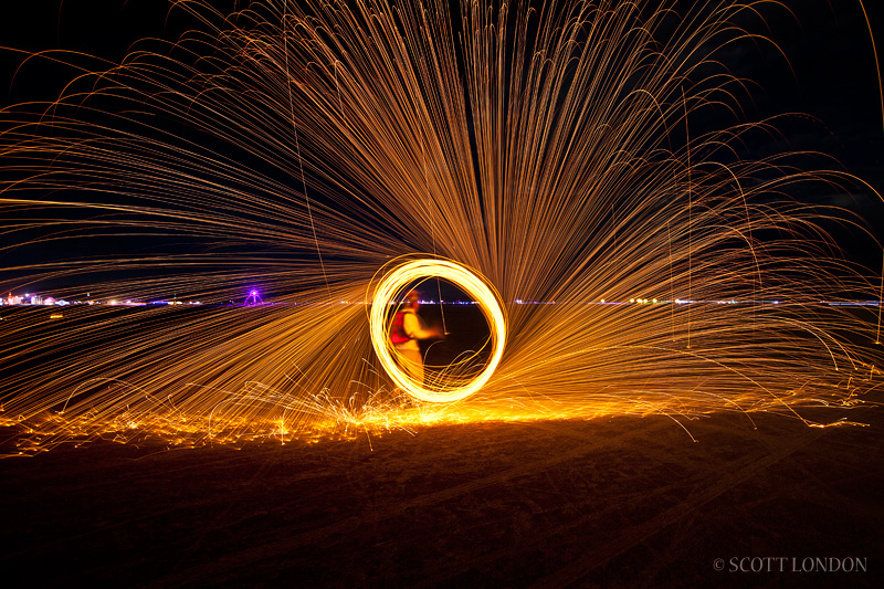 A Fire Spinner Performs with Steel Wool