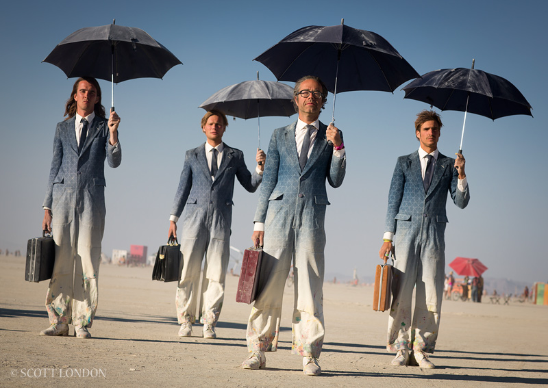 4 men with umbrellas