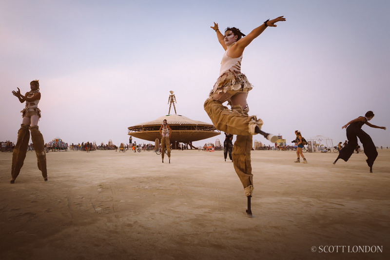 Stiltwalkers with the Oakland-based Carpetbag Brigade perform at Burning Man 2013 (Photo by Scott London)