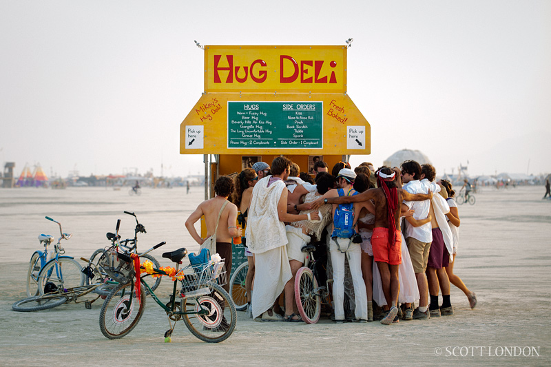 A group hug at the Hug Deli, an installation at Burning Man 2013 (Photo by Scott London)