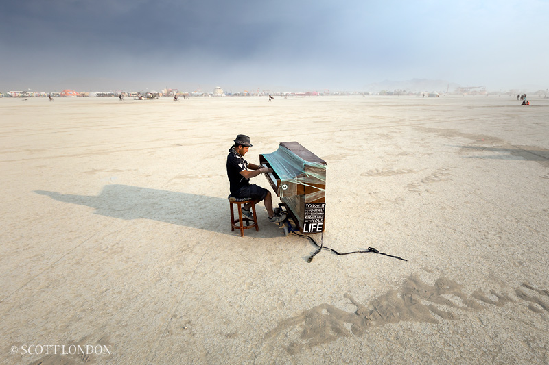 Dotan Negrin has crisscrossed the United States with his mobile upright piano, playing in the streets of more than 65 cities. Here he performs a beautiful classical piece, mostly to an empty playa, on the final day of Burning Man 2013