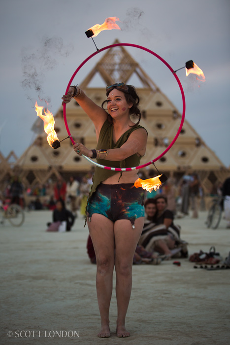 Cass, a Burner from Calgary, spinning a fire-hoop at the temple at Burning Man 2013 (Photo by Scott London)