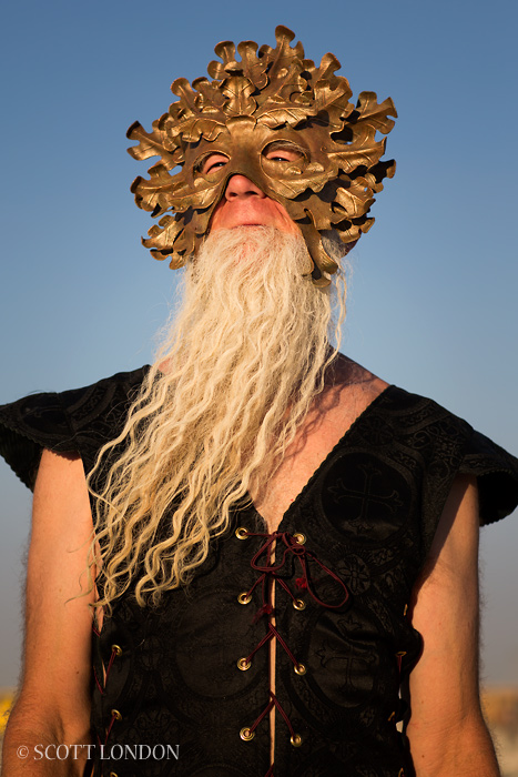 Riqo in a mask at Burning Man 2013 (Photo by Scott London)