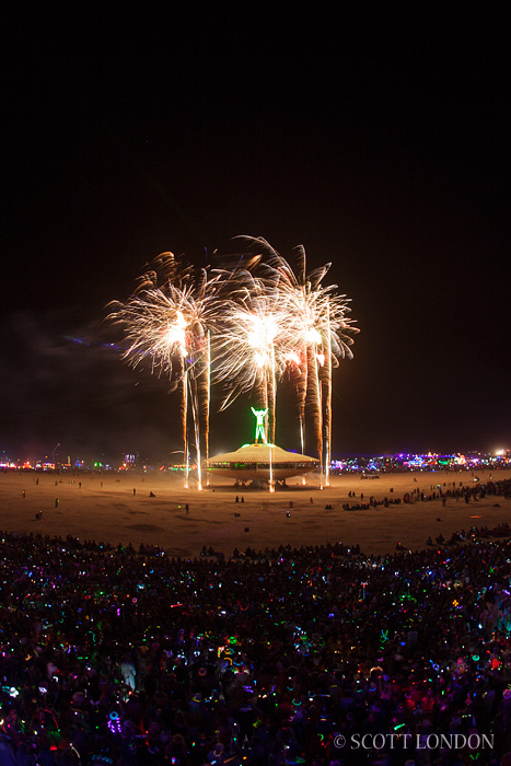 The Man goes up amid a display of fireworks at Burning Man 2013 (Photo by Scott London)