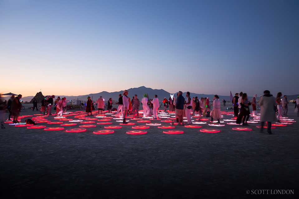 Super Pool, an interactive light installation by Jen Lewin, served as a psychedelic dance venue in the early morning twilight. Photo by Scott London