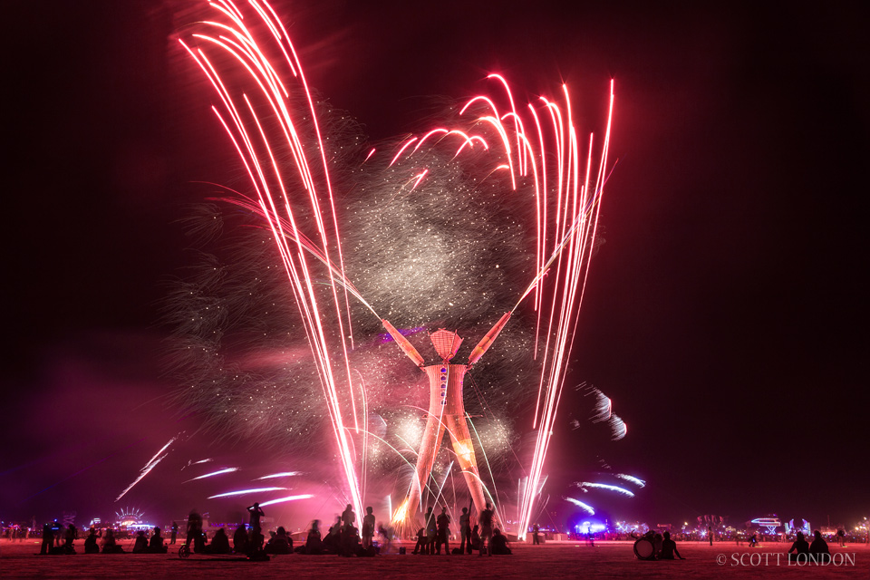 Fireworks go off before the man is burned at Burning Man 2014 (Photo by Scott London)
