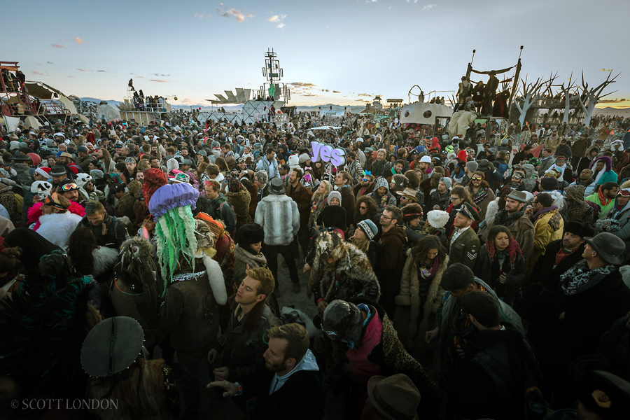 Crowds gather for the famous sunrise set at Robot Heart at Burning Man 2015. (Photo by Scott London)