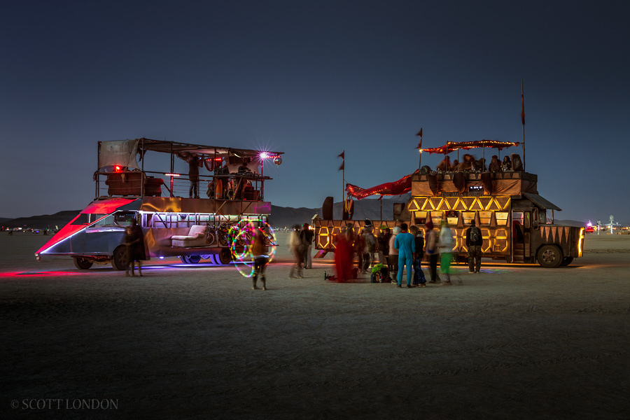 The Blackbird and the Janky Barge, two art cars, in the early morning twilight at Burning Man 2015. (Photo by Scott London)