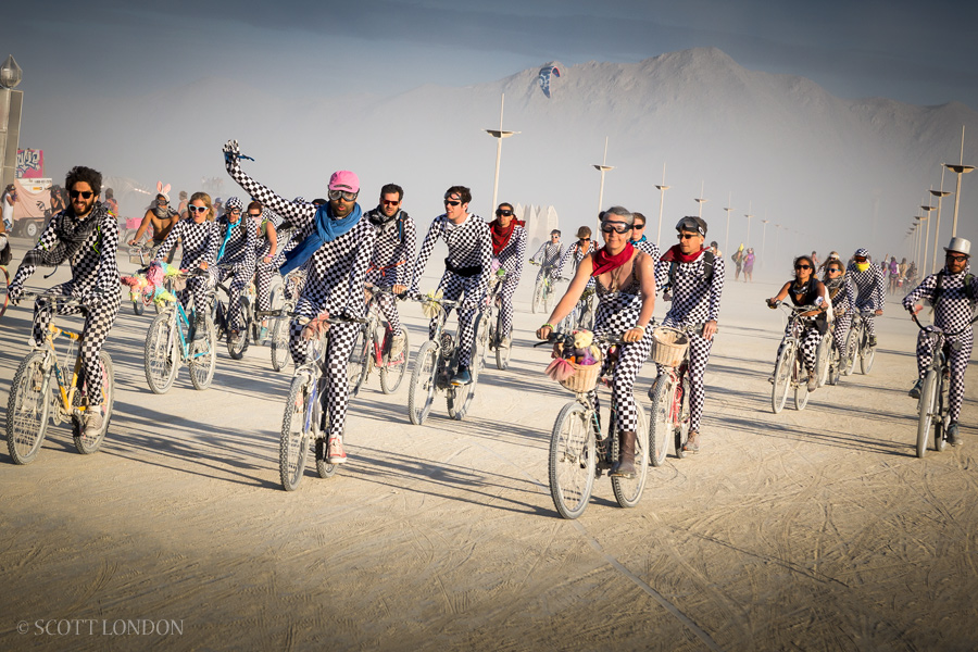 Checkered cyclists at Burning Man 2015. (Photo by Scott London)