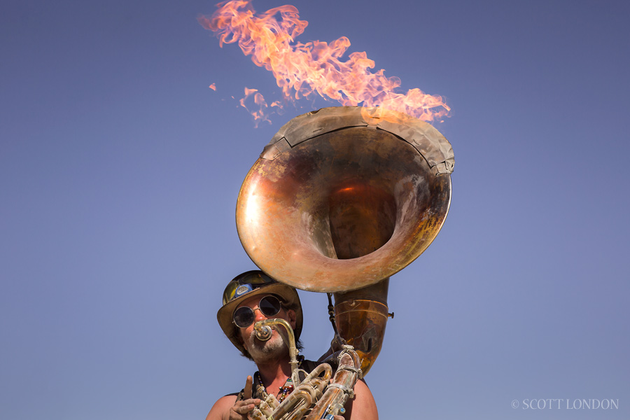 The Flaming Tuba Guy performing at the French Quarter at Burning Man 2015. (Photo by Scott London)