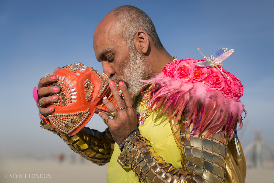 Designer Manish Arora kisses his fabulous skull handbag at Burning Man 2015. (Photo by Scott London)