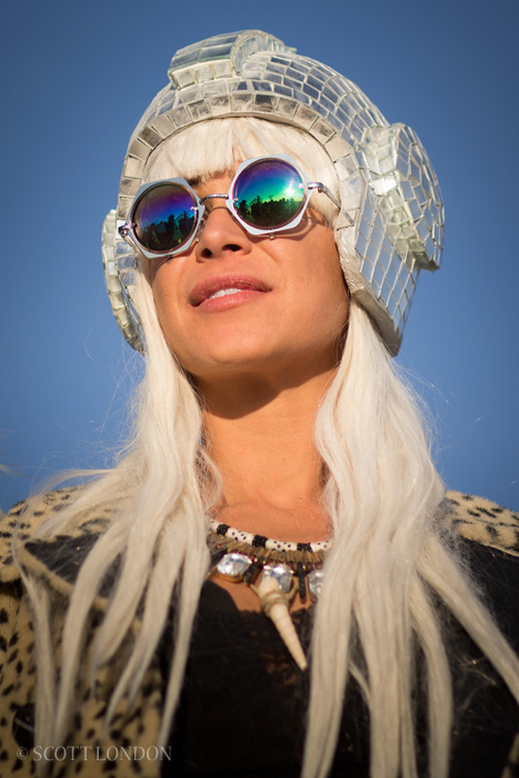 Kim in a mirrorball helmet at Robot Heart one morning at Burning Man 2015. (Photo by Scott London)