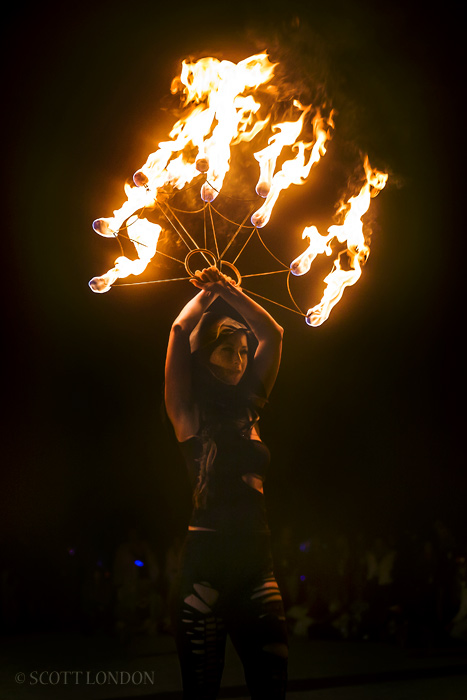 A dancer with the UK FireWorks Collective performs before the Man goes up in flames at Burning Man 2015. (Photo by Scott London)