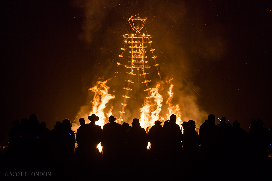 The Man burns before a crowd of tens of thousands on the penultimate night of Burning Man 2015. (Photo by Scott London)