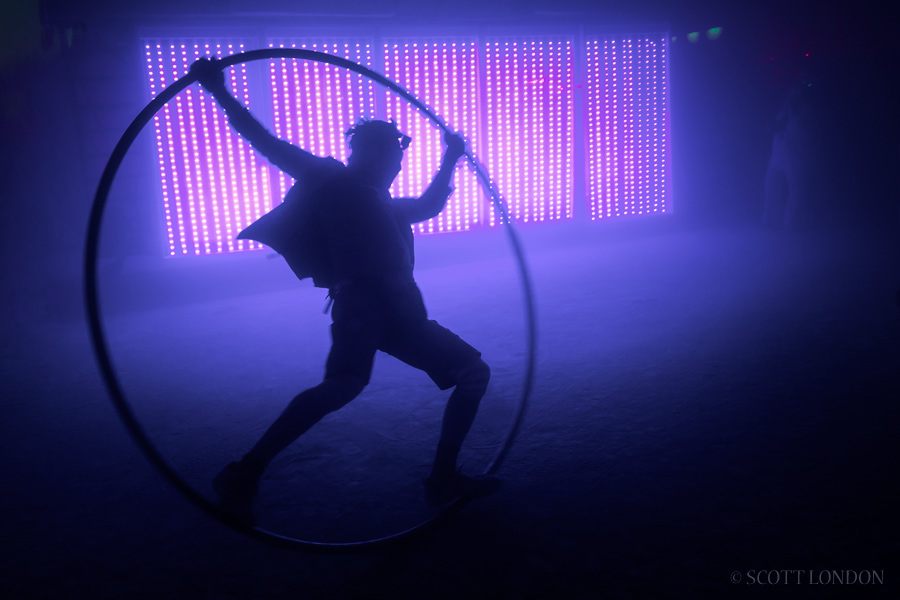 A roue cyr performer shows off some moves at Burning Man 2016 (Photo by Scott London)