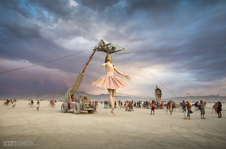 Step Forward, an installation centered around 'Euterpe' — a giant teenage girl puppet who walks and talks, and interacts with fellow Burning Man participants. (Photo by Scott London)