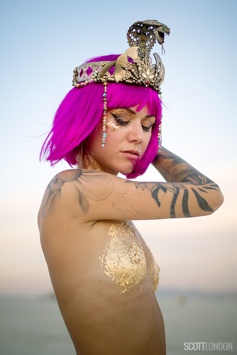 A beautiful Burner wearing a cobra headpiece at Burning Man 2017. (Photo by Scott London)