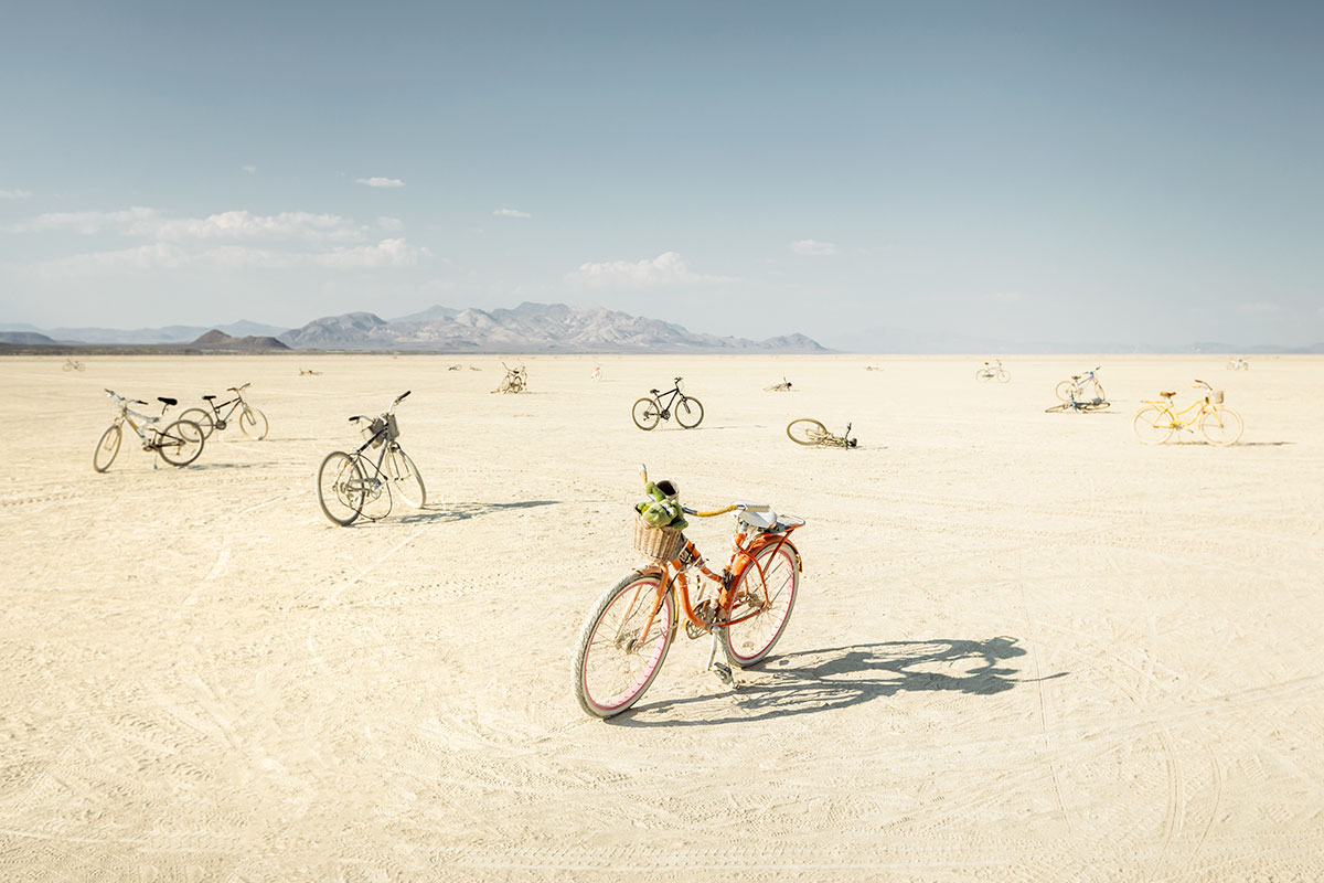 A wasteland of abandoned bicycles at the site of a sunrise dance party earlier in the day. (Photo by Scott London)