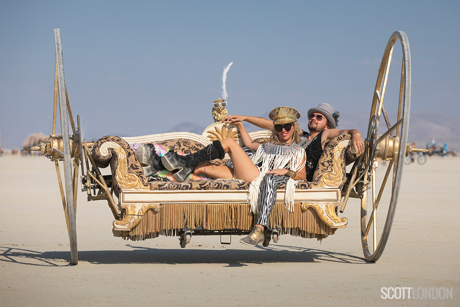 Stason and Jessica on their amazing Golden Chariot at Burning Man 2018. (Photo by Scott London)