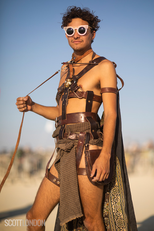 A Burner wearing a home-made outfit made of leather harnesses at Burning Man 2018. (Photo by Scott London)