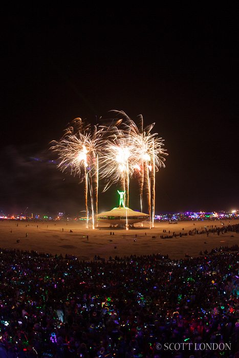 The Man goes up amid a display of fireworks at Burning Man 2013 (Photo by Scott London)