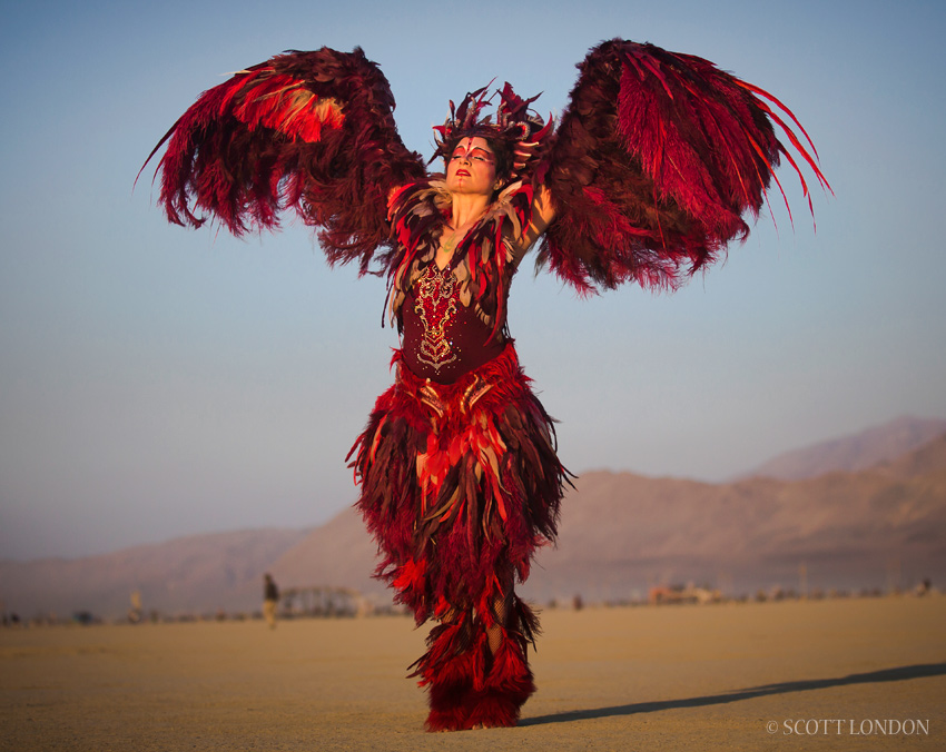 Bay Area artist and costume designer Ka danced at the temple in a red feather embodiment she called 'The Phoenix.' (Photo by Scott London)