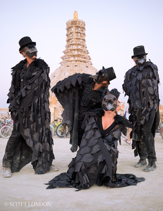Huck, Tangle, Nevin and Vanessa, four friends from Saskatchawan, participate in the annual White Procession dressed as black crows. (Photo by Scott London)