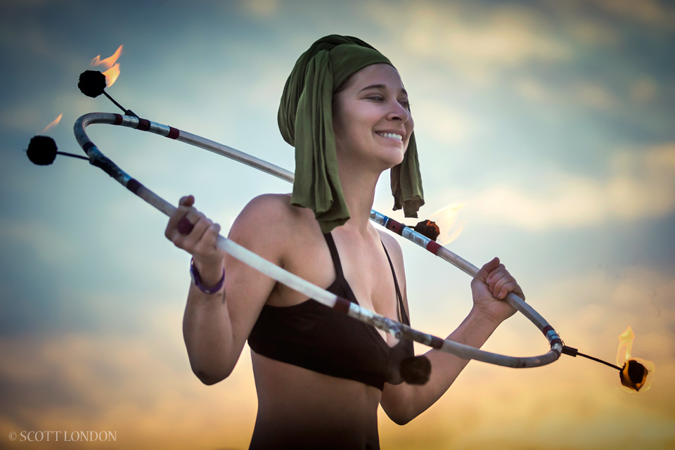 A fire hooper puts on a show at Burning Man 2014 (Photo by Scott London)