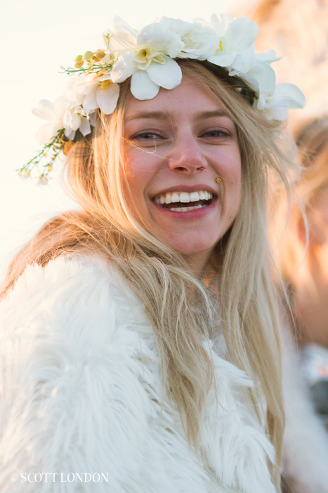 A woman with flowers in her hair at Burning Man 2016. (Photo by Scott London)